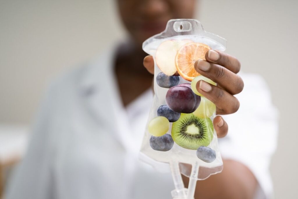 Fruit-filled IV bag symbolizing nutrients delivered through IV Therapy for Hydration.